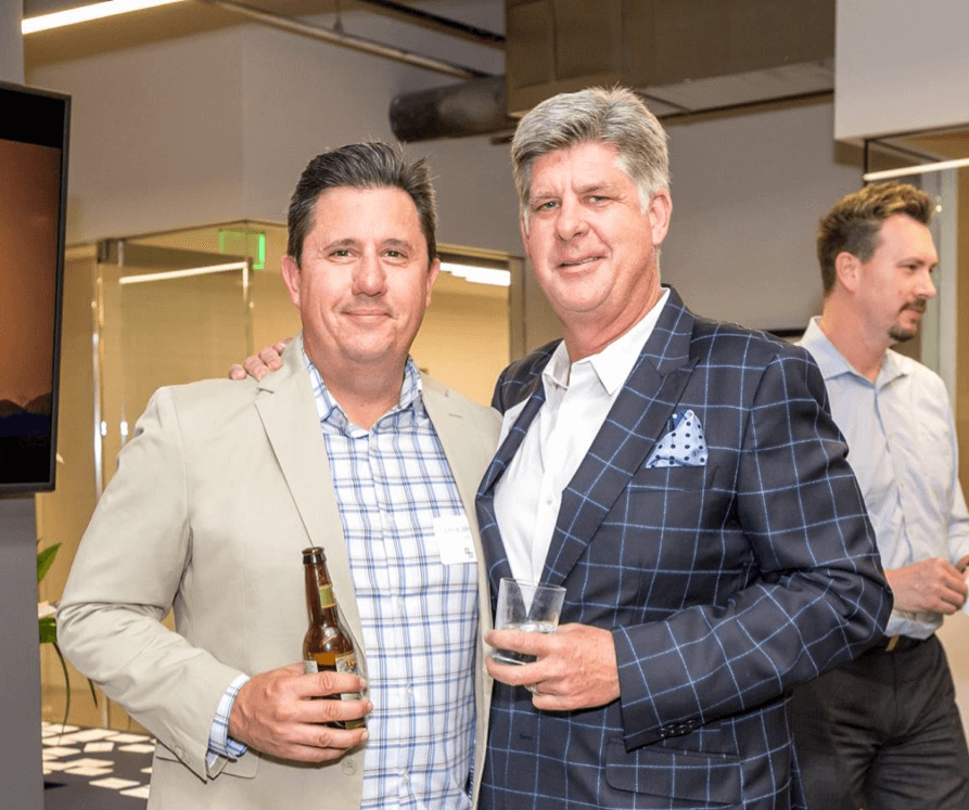 Chris Johnson and Beau Lane celebrate the new office location in Phoenix